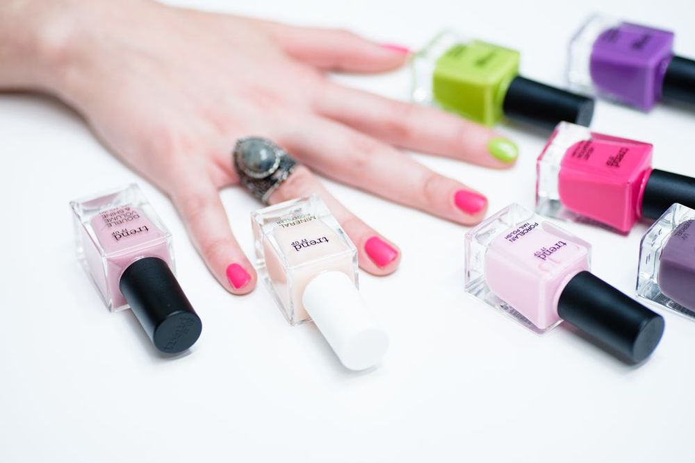 Colorful manicure with polish bottles